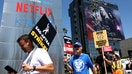 Striking SAG-AFTRA members picket with striking WGA (Writers Guild of America) workers outside Netflix offices on July 19, 2023 in Los Angeles, California.
