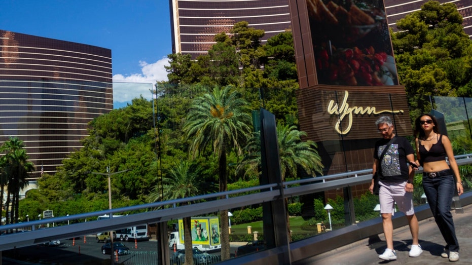 People walk by the Wynn Las Vegas and Encore resorts