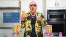 Two-time WWE Hall of Famer Ric Flair poses with his Wooooo! Energy Drinks