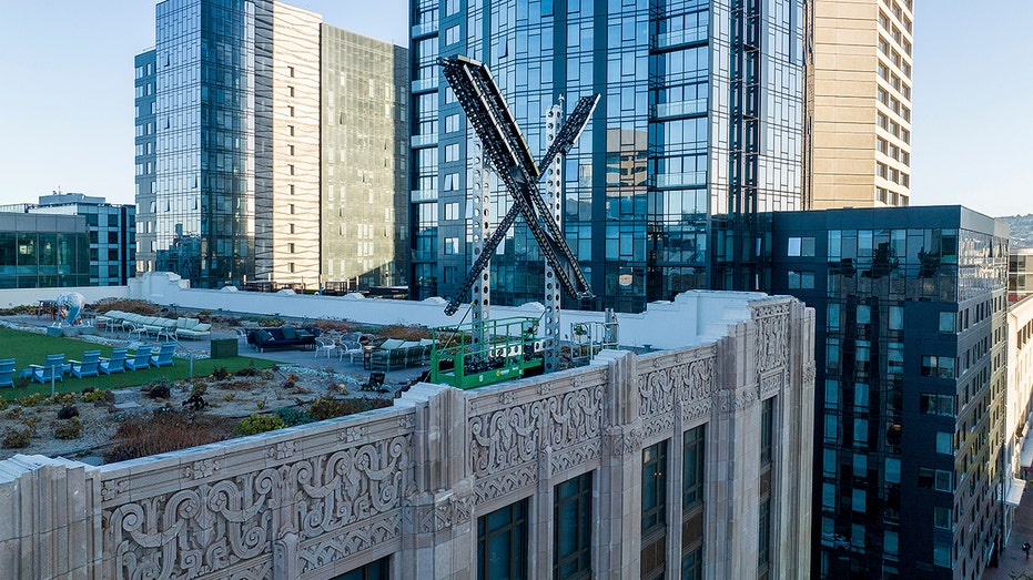 The X logo seen from the rooftop of Twitter HQ in San Francisco