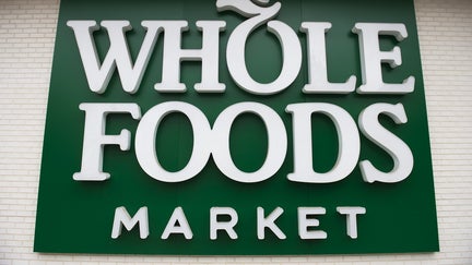 A Whole Foods Market sign is seen in Washington, DC, June 16, 2017, following the announcement that Amazon would purchase the supermarket chain for $13.7 billion. - Amazon is once again shaking up the retail sector, with the announcement it will acquire upscale US grocer Whole Foods Market, known for its pricey organic options,  in a deal that underscores the online giant's growing influence in the economy. 